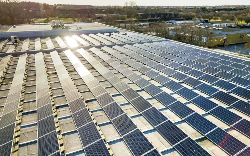 O3 commercial solar panels in rows on top of buildings